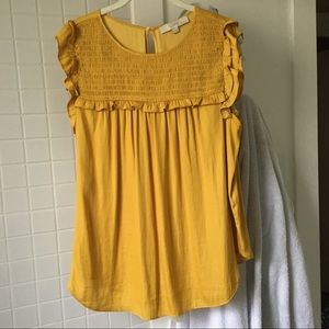 LOFT Sleeveless top with bib and arm detail.